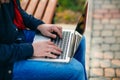 The young manager working on a laptop in the park. Lunch Break. Royalty Free Stock Photo