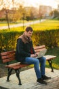 The young manager working on a laptop in the park. Lunch Break. Royalty Free Stock Photo