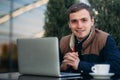 The young manager working on a laptop in the park. Lunch Break. Royalty Free Stock Photo