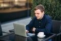 The young manager working on a laptop in the park. Lunch Break. Royalty Free Stock Photo