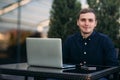 The young manager working on a laptop in the park. Lunch Break. Royalty Free Stock Photo