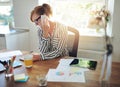 Young manageress working at her desk