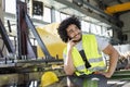 Young manual worker talking on mobile phone in metal industry Royalty Free Stock Photo