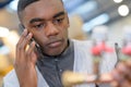 Young manual worker talking on mobile phone in metal industry Royalty Free Stock Photo