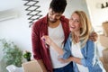 Young married couple with boxes and holding flat keys Royalty Free Stock Photo