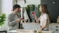 Young married couple drinks cocktails in the kitchen at home. A romantic couple spends time together, drinks at home. Royalty Free Stock Photo