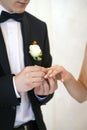 Young married couple, exchanging wedding rings