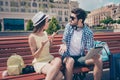 Young married couple got lost on vacation in town. Frustrated lady is arguing with her boyfriend, who holds pda, has no idea where