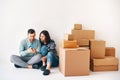 Young married couple plans home improvement projects in their new apartment on moving day Royalty Free Stock Photo