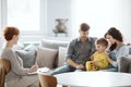 Young married couple with son during family therapy with counselor Royalty Free Stock Photo