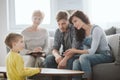 Young married couple with son during family therapy with counselor Royalty Free Stock Photo