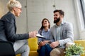 Young married couple at their advisor, counselor or agent Royalty Free Stock Photo