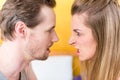 Young married couple, woman and man, in furious fight staring an Royalty Free Stock Photo