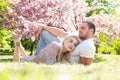 Young married people in love enjoying the spring beautiful nature. Beautiful young couple enjoying flowering garden. Man Royalty Free Stock Photo