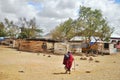 Young Masai walking through the savanna