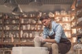 Young man at the potter`s wheel Royalty Free Stock Photo