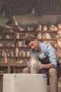 Young master working on a potter`s wheel Royalty Free Stock Photo