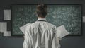 Mathematician studying math formulas on the chalkboard Royalty Free Stock Photo