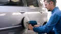 Young mechanics wearing clothes work in car garages for safety while working wear glasses prevent dust foreign matter,