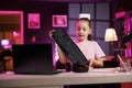 Young media star advertising wireless Bluetooth computer peripheral from partnering company