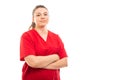 Young medical nurse wearing red scrub standing with arms crossed Royalty Free Stock Photo