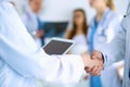 Young medical people handshaking at office Royalty Free Stock Photo