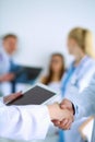 Young medical people handshaking at office Royalty Free Stock Photo