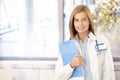 Young medical student smiling in office