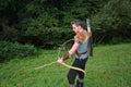 Young medieval archer with chain shirt, bow and arrow