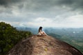 Young meditation in mountains. Tab Kak Hang Nak Hill Nature Trail. Thailand.