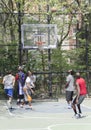 Young men in action playing basket ball in the street Royalty Free Stock Photo