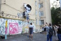 Young men activists set the poster portrait of famous Ukrainian poet and dissident Vasyl Stus on the wall of the