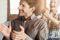 Young men applauding to speaker Royalty Free Stock Photo