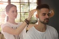 Young man during crystal healing session in room Royalty Free Stock Photo