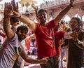 Young men dance during Holi Festival in India