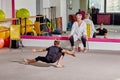 A young man dances at a ballet school. Sports lifestyle and body flexibility.