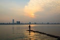 Young men fishing on West lake (Ho tay) Royalty Free Stock Photo