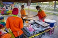 Young men frying Youtiao or Cakoi, a long golden-brown deep-fried strip of dough commonly. On a fresh market in Malaysia open air