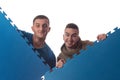 Young Men Holding Blue Tatami Mat Puzzle Royalty Free Stock Photo