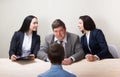 Young man during job interview and members of managemen Royalty Free Stock Photo