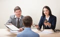 Young man during job interview and members of managemen. Royalty Free Stock Photo