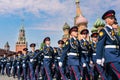 Young men in military uniforms on Red Square in Moscow against the background of the Kremlin. A detachment of soldiers