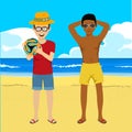 Young men posing with soccer ball on summer beach Royalty Free Stock Photo