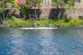 Young men practice canoeing riding in his canoe navigating the Jerte river, Spain