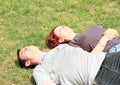 Couple of lovers lying on meadow