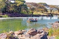 Young men rowing a boat on the Galana River Royalty Free Stock Photo