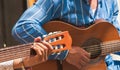 Young men`s hands strumming a guitar in Madrid, Spain Royalty Free Stock Photo