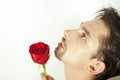 Young men smell the red rose isolated on white Royalty Free Stock Photo