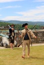 Young men in soldier`s clothing, demonstrating the firing of canons, Fort Ticonderoga, New York, 2016