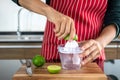 Young men squeezing lemonade in the kitchen Royalty Free Stock Photo